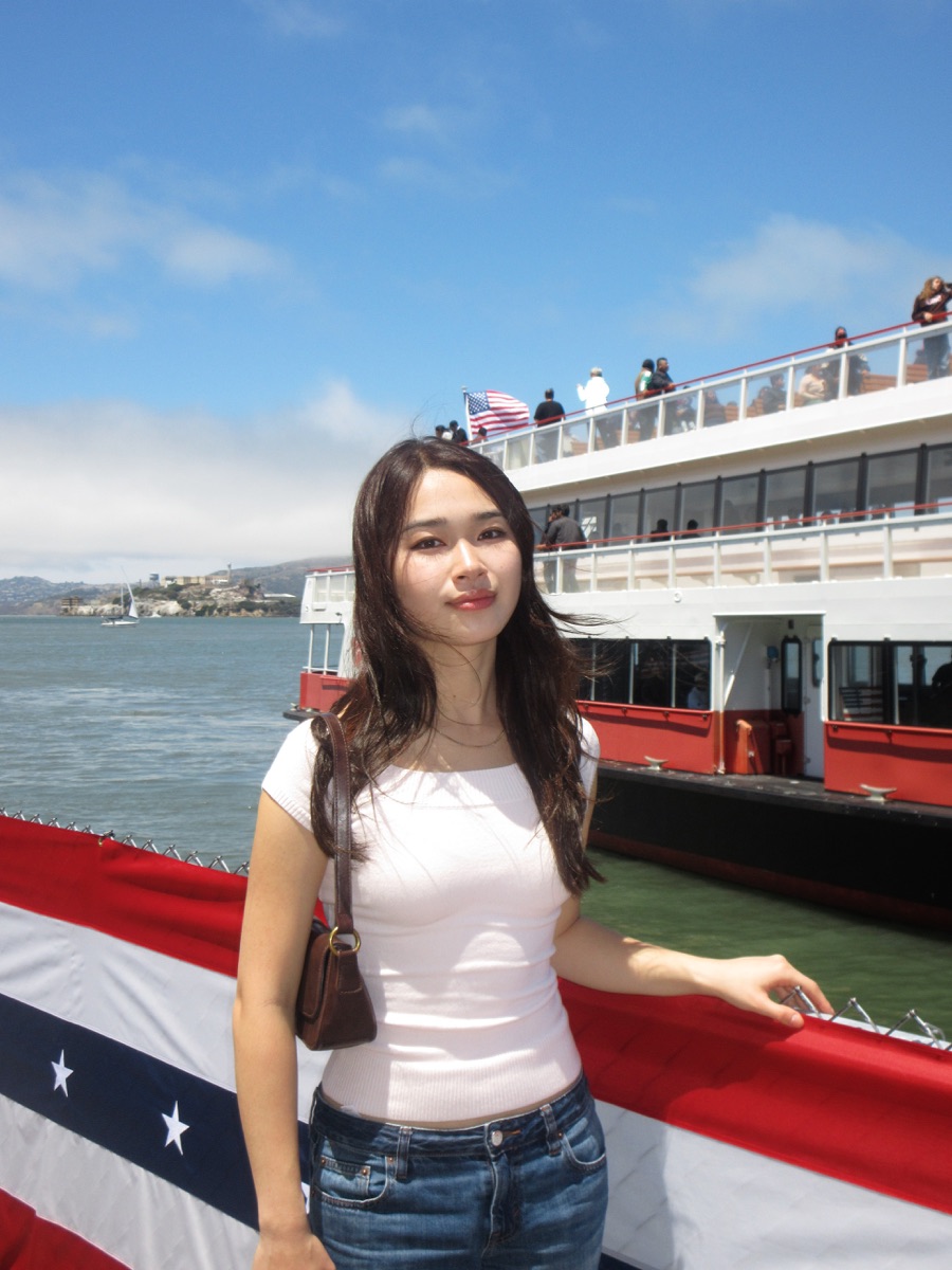 Jennifer by the water beside a ferry